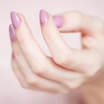 Person's Hand With Pink Manicure